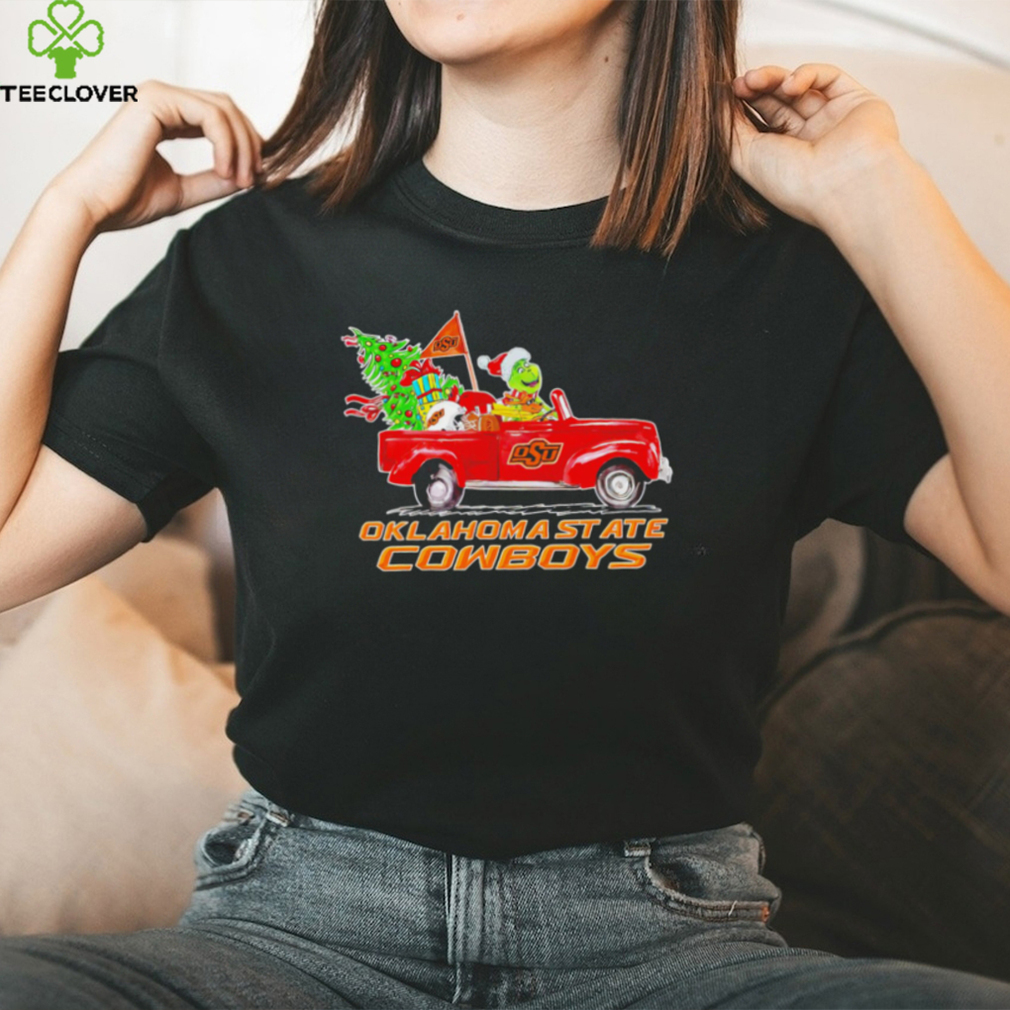 Happy Merry Christmas The Grinch drive a car Oklahoma State Cowboys football logo flag gift shirt Happy Merry Christmas The Grinch drive a car Oklahoma State Cowboys football logo flag gift shirt