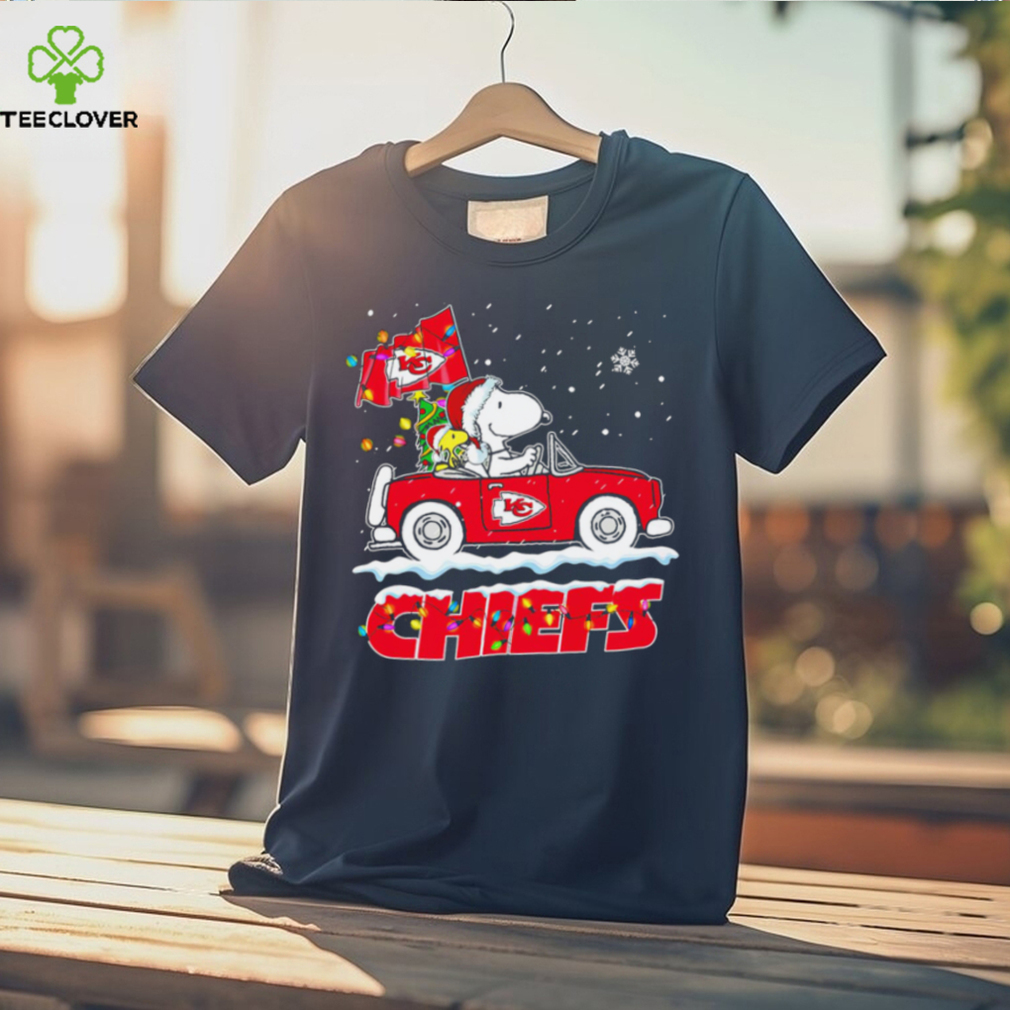 Happy Merry Christmas Snoopy drive a car Kansas City Chiefs logo flag gift shirt Happy Merry Christmas Snoopy drive a car Kansas City Chiefs logo flag gift shirt