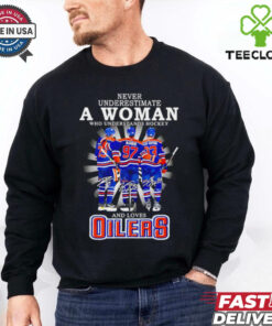 A woman who understands hockey and loves Oilers hockey shirt