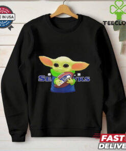 Baby Yoda holding Seattle Seahawks football shirt