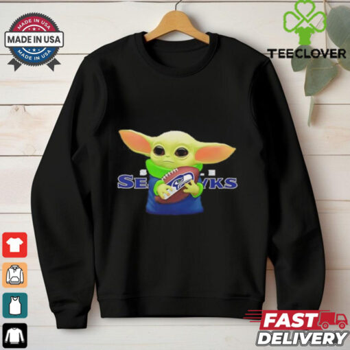 Baby Yoda holding Seattle Seahawks football shirt