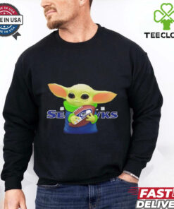 Baby Yoda holding Seattle Seahawks football shirt
