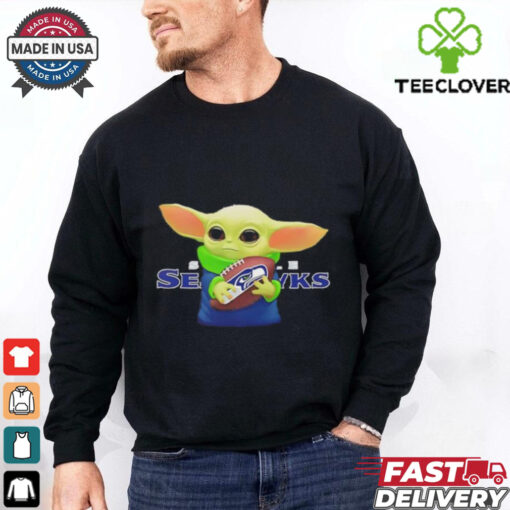Baby Yoda holding Seattle Seahawks football shirt