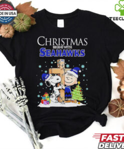 Christmas begins with Snoopy Seattle Seahawks God bless shirt