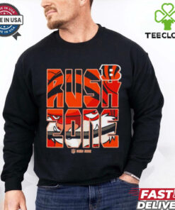 The **Cincinnati Bengals NFL Rush Zone Football Logo Shirt** features the iconic Bengals logo, combining the team's bold design with the energetic Rush Zone theme. The shirt celebrates the excitement of football and the Bengals’ passionate fan base, offering a stylish and sporty look for any Cincinnati Bengals supporter. It's perfect for game days, tailgating, or simply showing off your Bengals pride!
