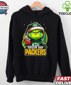 Green Bay Packers Grinch wearing Santa hat Christmas 2024 shirt