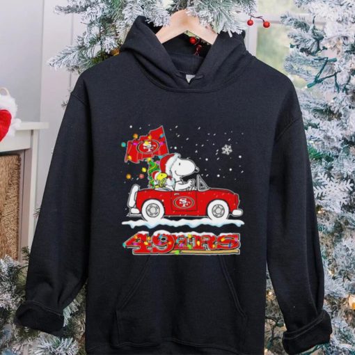 Happy Merry Christmas Snoopy drive a car San Francisco 49ers logo flag gift hoodie, sweater, longsleeve, shirt v-neck, t-shirt