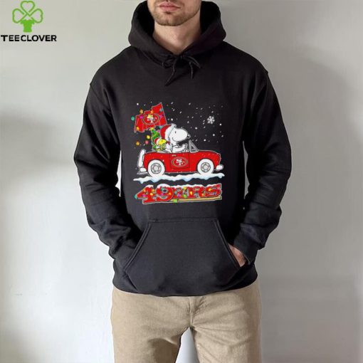 Happy Merry Christmas Snoopy drive a car San Francisco 49ers logo flag gift hoodie, sweater, longsleeve, shirt v-neck, t-shirt