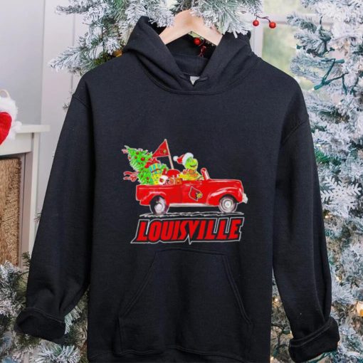 Happy Merry Christmas The Grinch drive a car Louisville Cardinals football logo flag gift hoodie, sweater, longsleeve, shirt v-neck, t-shirt