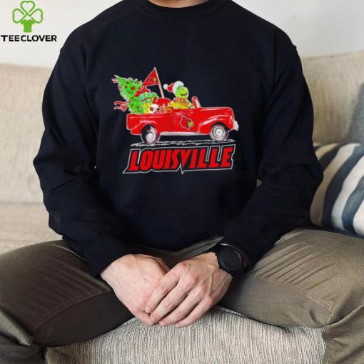 Happy Merry Christmas The Grinch drive a car Louisville Cardinals football logo flag gift hoodie, sweater, longsleeve, shirt v-neck, t-shirt