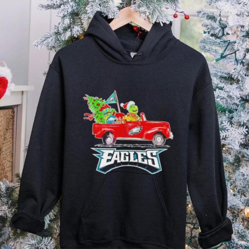 Happy Merry Christmas The Grinch drive a car Philadelphia Eagles football logo flag gift hoodie, sweater, longsleeve, shirt v-neck, t-shirt