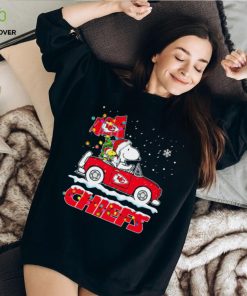 Happy Merry Christmas Snoopy drive a car Kansas City Chiefs logo flag gift shirt 1 Happy Merry Christmas Snoopy drive a car Kansas City Chiefs logo flag gift shirt