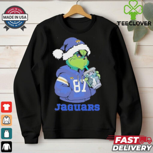 Jacksonville Jaguars Grinch Santa drinking Eras Tour cup shirt