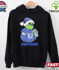 Jacksonville Jaguars Grinch Santa drinking Eras Tour cup shirt