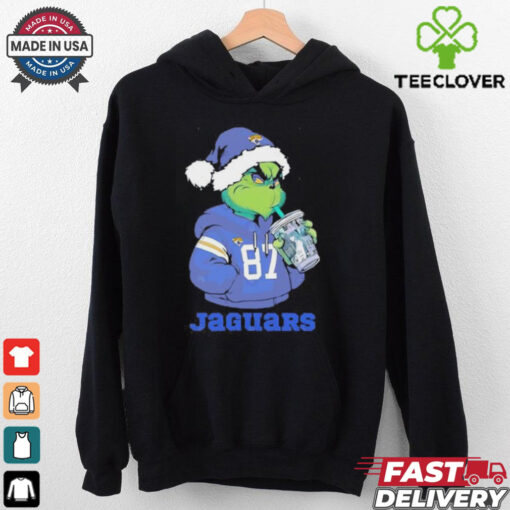 Jacksonville Jaguars Grinch Santa drinking Eras Tour cup shirt