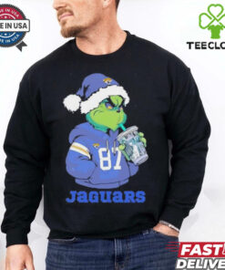 Jacksonville Jaguars Grinch Santa drinking Eras Tour cup shirt