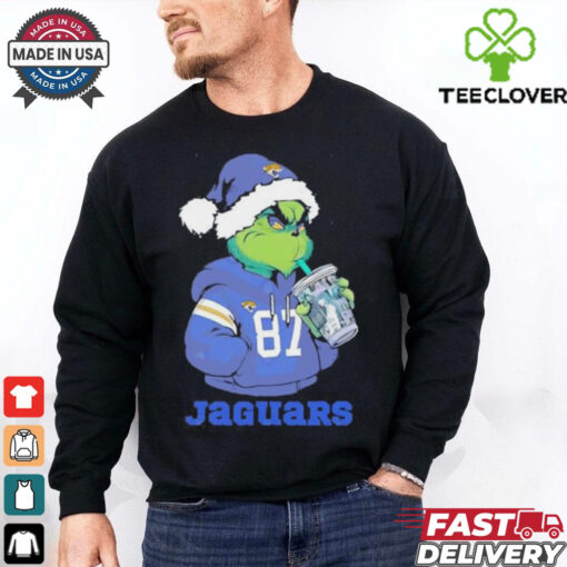 Jacksonville Jaguars Grinch Santa drinking Eras Tour cup shirt