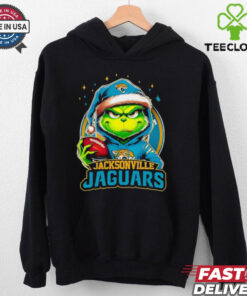 Jacksonville Jaguars Grinch wearing Santa hat Christmas 2024 shirt