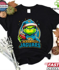 Jacksonville Jaguars Grinch wearing Santa hat Christmas 2024 shirt