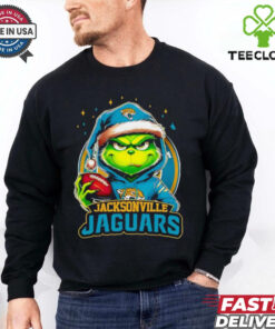 Jacksonville Jaguars Grinch wearing Santa hat Christmas 2024 shirt