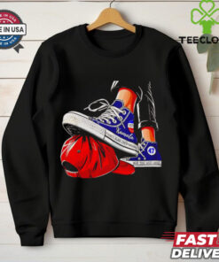 Kamala chucks stepping on Trump hat shirt