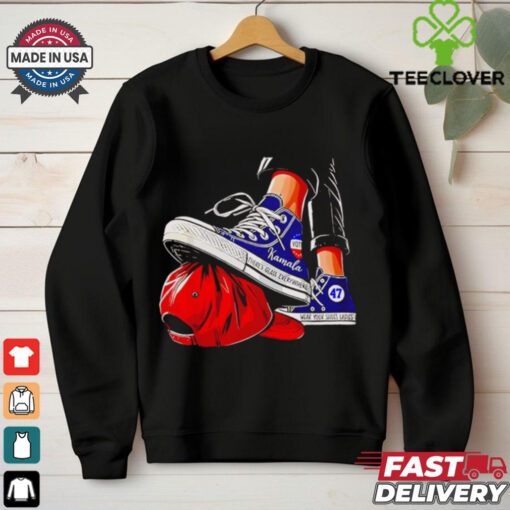 Kamala chucks stepping on Trump hat shirt