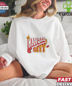The **Kansas City Football Stickers Shirt** features a fun, sticker-style design showcasing the iconic Kansas City football team. A great way for fans to display their team spirit with a unique and playful touch!