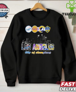 Los Angeles Dodgers x Los Angeles Lakers x Los Angeles Rams x Los Angeles Galaxy City Skyline Los Angeles City of Champions T-shirt featuring a dynamic design that celebrates the city's legendary sports teams. Show your pride for Los Angeles as the City of Champions with this iconic, all-in-one apparel for fans of every L.A. team.