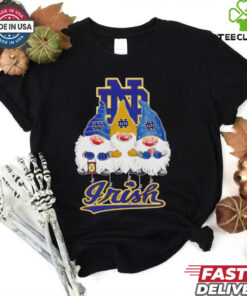 Merry Christmas Gnomies Fans of Notre Dame Fighting Irish Shirt featuring a festive design with holiday gnomes celebrating the Notre Dame Fighting Irish.