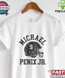Michael Penix Jr. Atlanta Falcons NFL Football Helmet Font Vintage Shirt, featuring a retro-inspired design with Michael Penix Jr.'s name and the Atlanta Falcons' helmet logo in a classic football font. This shirt blends a vintage style with modern flair, perfect for fans who want to honor both the player and the team with a unique, throwback look.