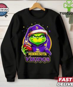 Minnesota Vikings Grinch wearing Santa hat Christmas 2024 shirt
