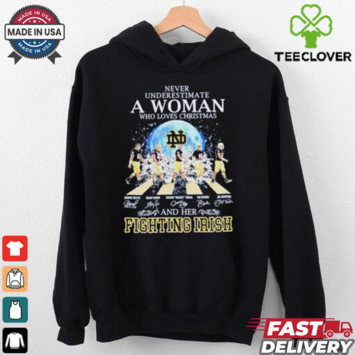Never Underestimate A Woman Who Loves Christmas And Her Notre Dame Fighting Irish Abbey Road Signatures Shirt