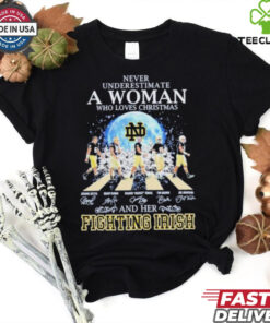 Never Underestimate A Woman Who Loves Christmas And Her Notre Dame Fighting Irish Abbey Road Signatures Shirt