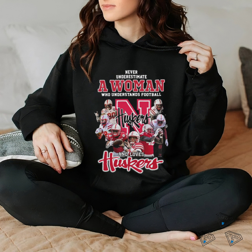 Never underestimate a woman who understands football and loves Nebraska Corn Huskers shirt Never underestimate a woman who understands football and loves Nebraska Corn Huskers shirt