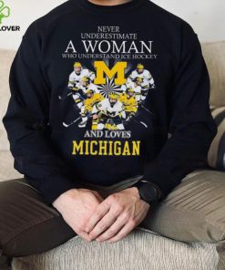 Never underestimate a woman who understands ice hockey and loves michigan wolverines shirt