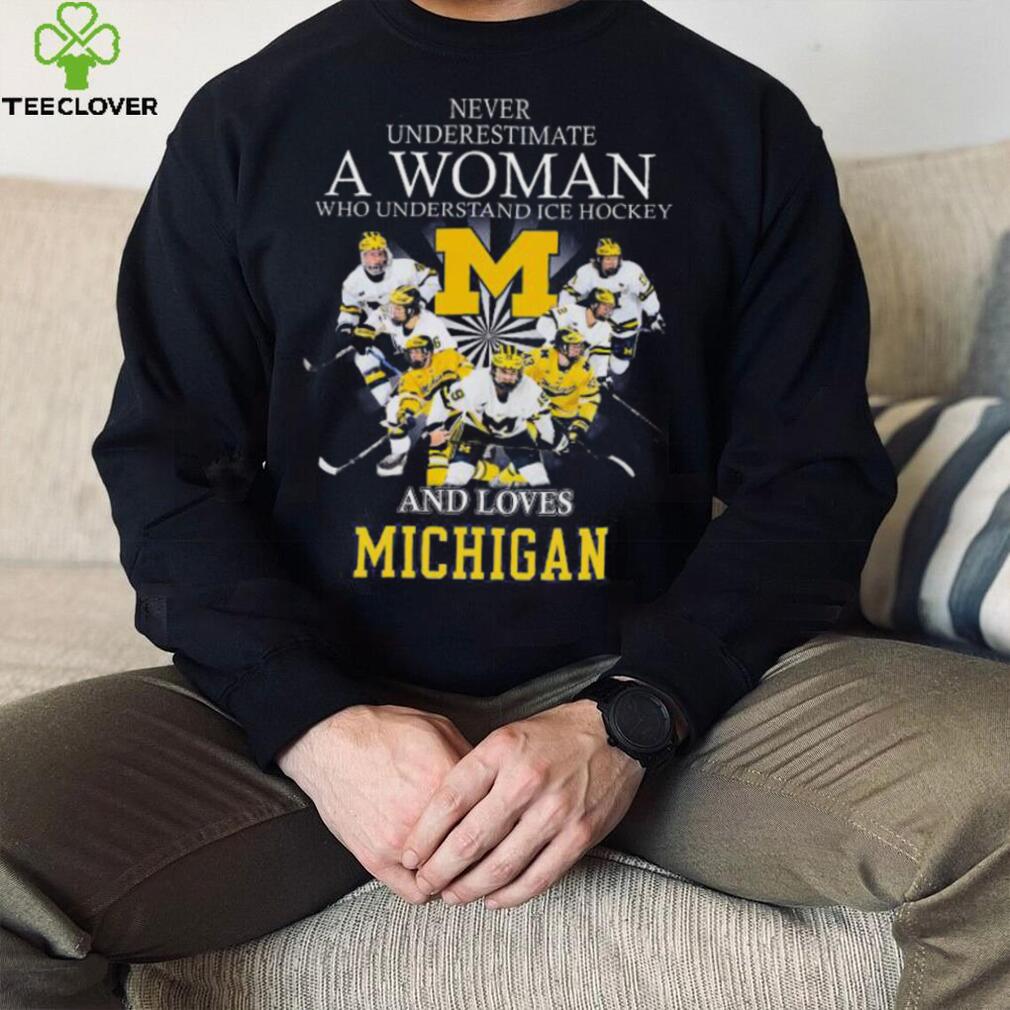 Never underestimate a woman who understands ice hockey and loves michigan wolverines shirt