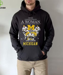 Never underestimate a woman who understands ice hockey and loves michigan wolverines shirt