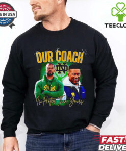 **Notre Dame Fighting Irish Our Coach Is Hotter Than Yours Graphic Shirt** – Show off your team pride with a touch of humor and bold style. Perfect for passionate Notre Dame fans who know their coach stands out on and off the field!