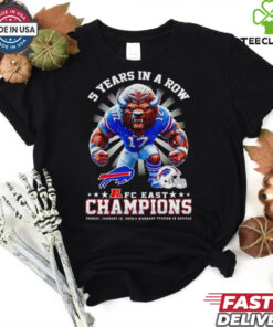 The **Official 5 Years in a Row AFC East Champions Mascot Shirt** celebrates a remarkable achievement for the team, featuring their mascot and the iconic AFC East Championship recognition. A must-have for fans who want to show their pride in this impressive streak of success!
