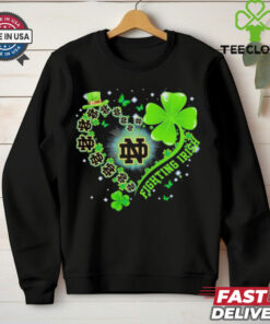 The **Official Clover Heart Notre Dame Fighting Irish Shirt** combines team pride with a unique clover heart design. Perfect for fans of the Fighting Irish who want to showcase their love for the team in a stylish and meaningful way!