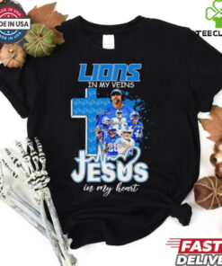 Official Dan Campbell and Players Detroit Lions In My Veins, Jesus In My Heart Shirt featuring a powerful design that combines your love for the Detroit Lions and faith. Show your unwavering support for both the team and your spiritual beliefs with this unique, heartfelt apparel.