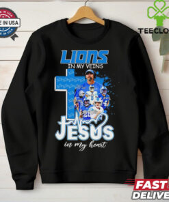 Official Dan Campbell and Players Detroit Lions In My Veins, Jesus In My Heart Shirt featuring a powerful design that combines your love for the Detroit Lions and faith. Show your unwavering support for both the team and your spiritual beliefs with this unique, heartfelt apparel.