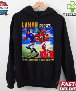 The **Official Lamar Passes Vick the Most Rushing Yards by a QB in NFL History Shirt** honors Lamar Jackson’s record-breaking achievement as the QB with the most rushing yards in NFL history. Featuring bold graphics, this shirt is perfect for fans celebrating Lamar’s historic milestone!