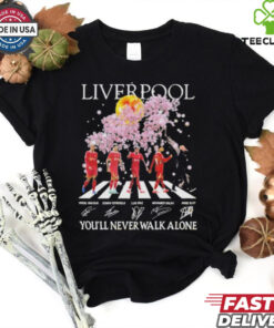 Official Liverpool – You'll Never Walk Alone Signature Unisex T-Shirt with a powerful design featuring the iconic slogan and player signatures, perfect for Liverpool fans.