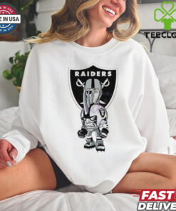 **Official Rush Zone Las Vegas Raiders NFL Cartoon Character 2025 Shirt** features a bold depiction of the Raiders' iconic Rush Zone cartoon character in striking silver and black colors, capturing the fierce spirit of Raider Nation. This unisex shirt blends playful animation with the classic Raiders' emblem, making it a must-have for die-hard fans. Perfect for game days or casual wear, this 2025 design celebrates Las Vegas Raiders pride in a fun and dynamic way!