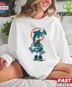 **Official Rush Zone Miami Dolphins NFL Cartoon Character 2025 Shirt** showcases the Miami Dolphins' beloved Rush Zone cartoon character in vibrant aqua and orange hues, bringing the team’s dynamic spirit to life. This unisex shirt combines playful animation with iconic Dolphins branding, making it perfect for fans of all ages. Celebrate your Miami Dolphins pride with this unique 2025 design that’s both fun and stylish—a standout addition to any fan’s wardrobe!