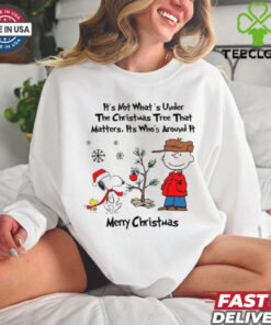 Official Snoopy Charlie Brown And Woodstock It’s Not What’s Under The Tree That Matters It’s What’s Around It Merry Christmas 2024 Shirt