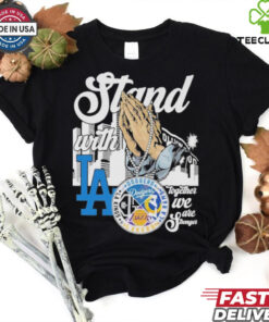 The **Official Stan With Los Angeles Lakers x Los Angeles Rams x Los Angeles Dodgers x Los Angeles Kings Shirt** celebrates Los Angeles' top sports teams. Featuring iconic logos or symbols representing the Lakers, Rams, Dodgers, and Kings, this shirt is perfect for fans who stand united in their support of LA's legendary franchises!