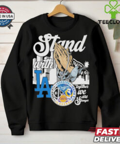 The **Official Stan With Los Angeles Lakers x Los Angeles Rams x Los Angeles Dodgers x Los Angeles Kings Shirt** celebrates Los Angeles' top sports teams. Featuring iconic logos or symbols representing the Lakers, Rams, Dodgers, and Kings, this shirt is perfect for fans who stand united in their support of LA's legendary franchises!