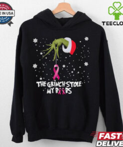 Official The Grinch Hand Holding Breast Cancer The Grinch Stole My Boobs Merry Christmas 2024 Gift Shirt featuring a humorous yet meaningful design combining the Grinch theme with a message of support for breast cancer awareness, making it a unique holiday gift.